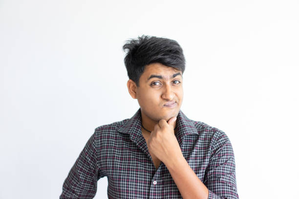 istock Puzzled Indian guy full of doubts 1124605473