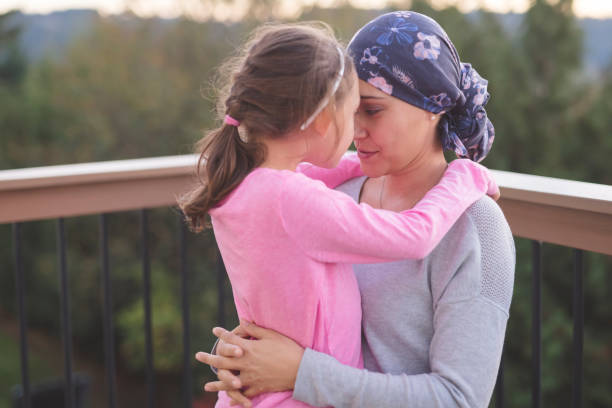 istock Mother with cancer hugging her daughter 1124605493