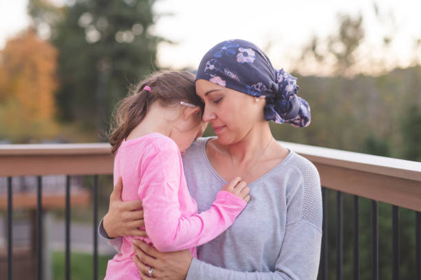 istock Mother with cancer hugging her daughter 1124605496