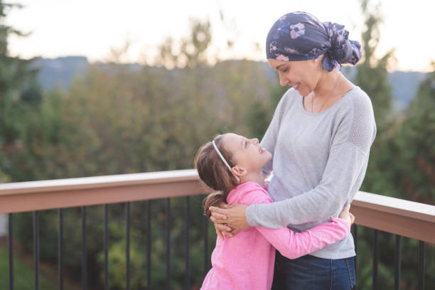 istock Mother with cancer hugging her daughter 1124605497