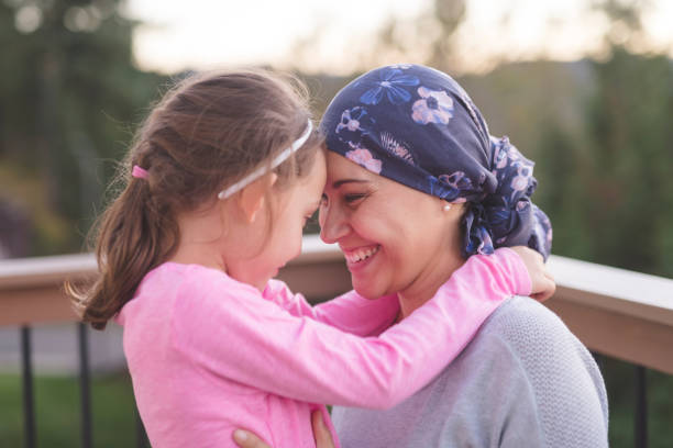 istock Mother with cancer hugging her daughter 1124605498