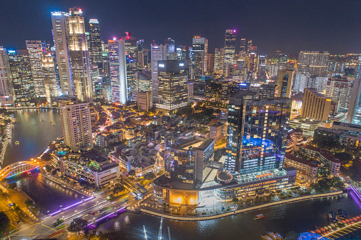 Aerial view of Singapore cityscape at dusk. Landscape of Singapore Marina bay with modern buildings and skyscrapers at night