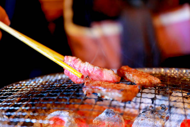 istock Japanese grilled meat over charcoal on stove 1124610426