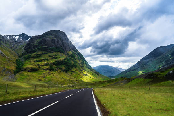 istock Winding mountain road without cars 1124611314