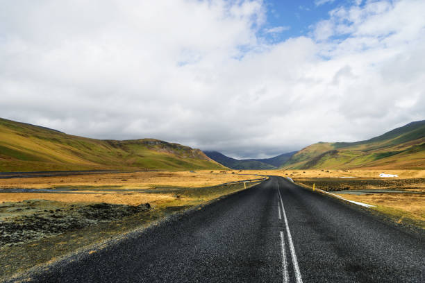 istock Winding mountain road without cars 1124611322