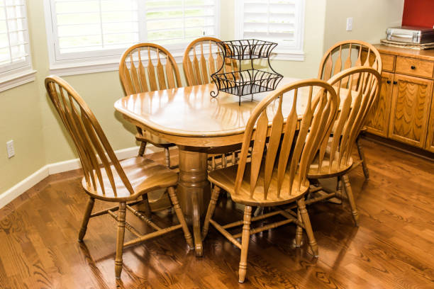 istock Wooden Table And Chairs On Hardwood Floor 1124612257
