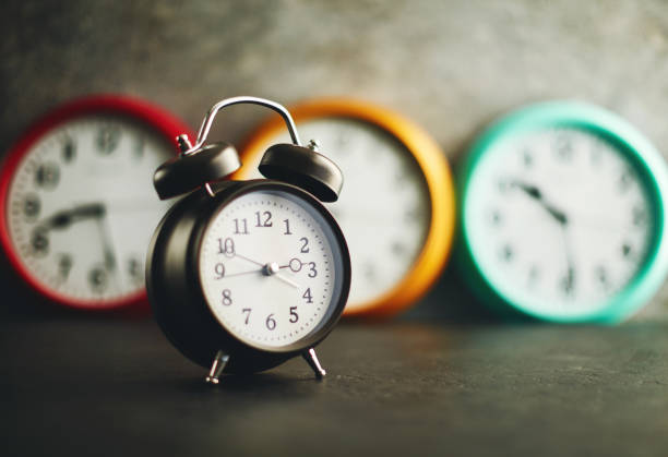 istock Collection of vibrant colored wall clocks with alarm clock 1124613029