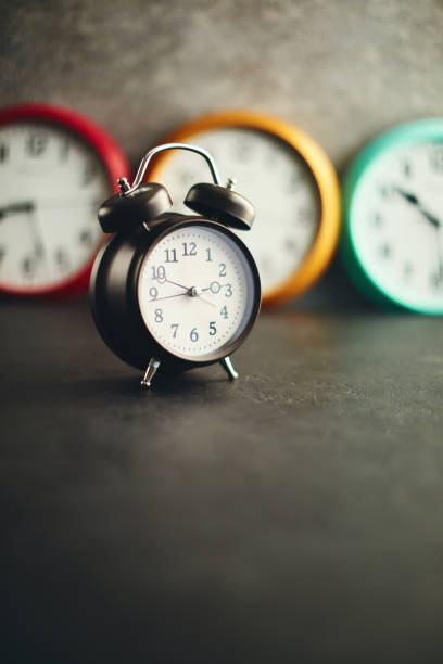 istock Collection of vibrant colored wall clocks with alarm clock 1124613045