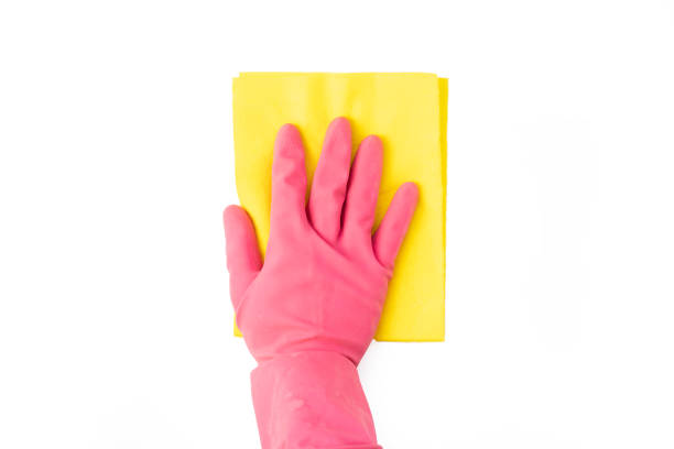 istock close up persons hand in protective glove hold clean supply on white surface isolated. housekeeping concept b 1124613291