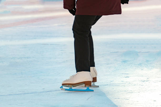istock woman ice skate on the rink 1124615245