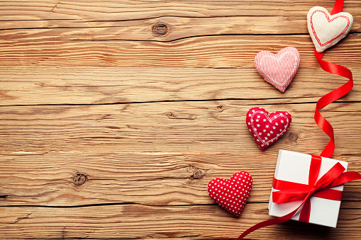 Valentines day background with hearts and gift