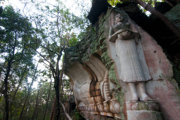 istock Buddha statue Carved At cliff in Thailand 1124624589