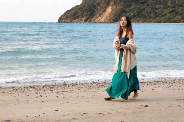 istock Playing Ukulele On a Chilly Day at the Beach 1124627016