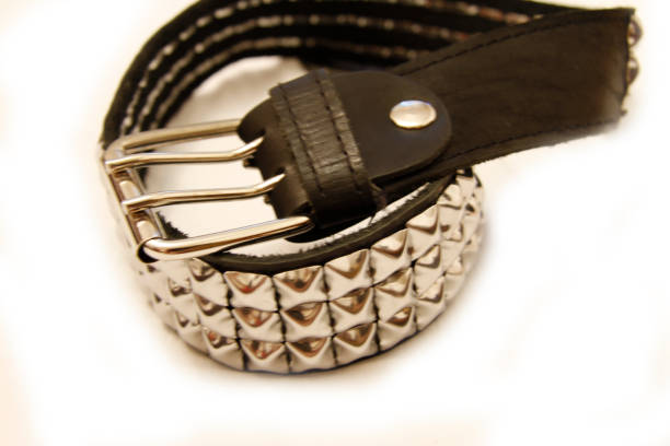 istock Black leather belt isolated on the white background 1124627095