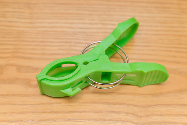 istock green clothespin on a wood background 1124629060