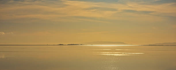 istock Panoramic of a sunset in the ebro delta by the sea 1124630721