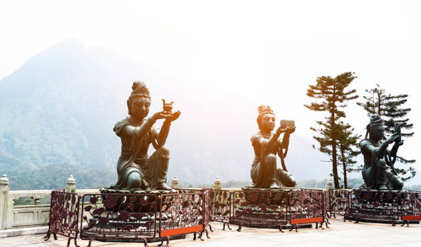 istock Buddhist statues making offerings to Tian Tan Buddha 1124633382