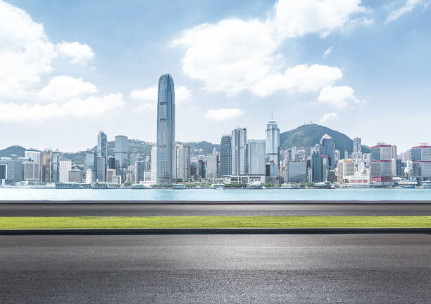 istock Empty asphalt road leading to downtown Hong Kong 1124634353