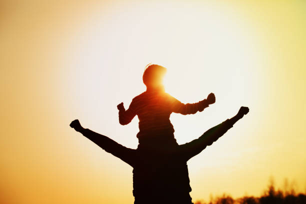 istock father and son play at sunset sky 1124634502