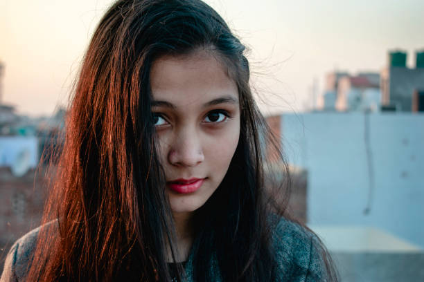 istock beautiful happy Asian girl looking at camera 1124634654