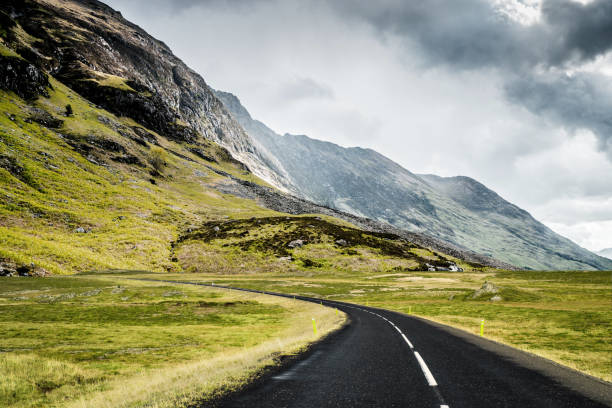 istock Winding mountain road without cars 1124635798