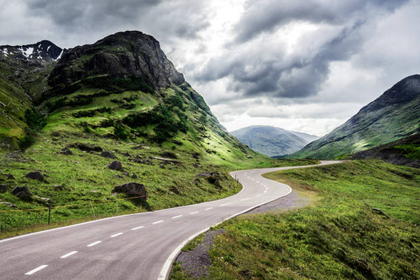 istock Winding mountain road without cars 1124635803