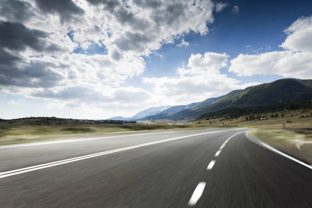 istock Winding mountain road without cars 1124635814