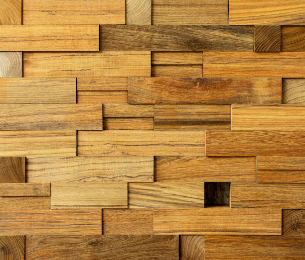 istock Teak wood block profile background, wooden rectangular and square blocks stacked up in different sizes making an abstract wood block background, with one empty square hole not filled by wood, noticeable by standing out from the crowd. 1124635860