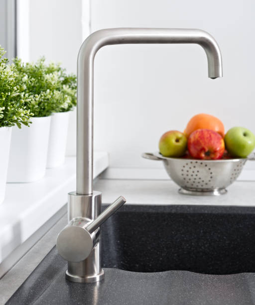 istock Fruit in the cup on the kitchen sink near the water tap. 1124635892