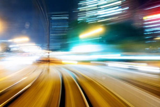 istock Motion blur railroad track in the city at night 1124638761