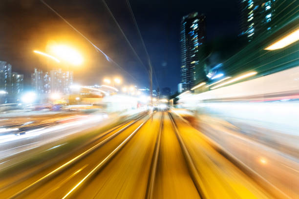 istock Motion blur railroad track in the city at night 1124639617