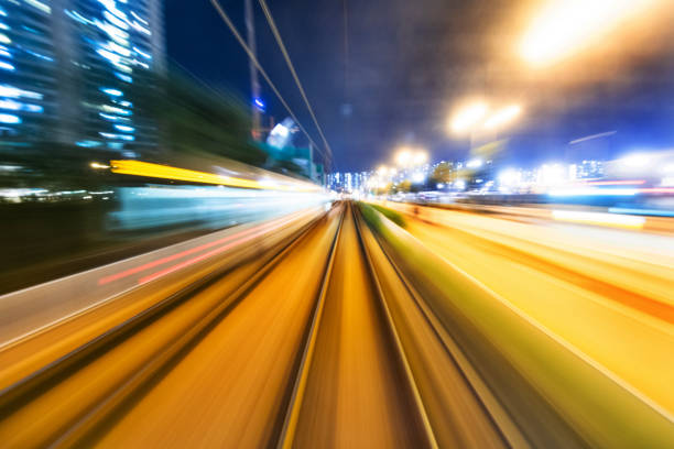 istock Motion blur railroad track in the city at night 1124639773
