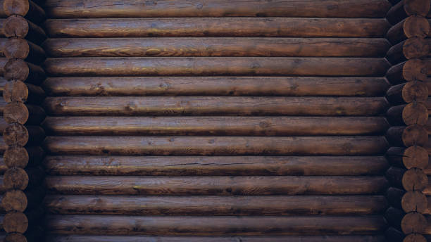 Dark colored wooden cabin wall texture background stock photo
