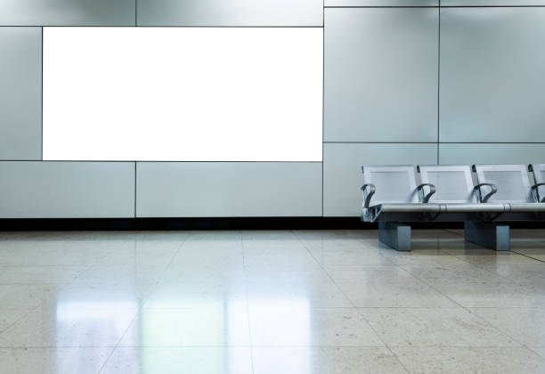 Blank billboard in airport waiting area.