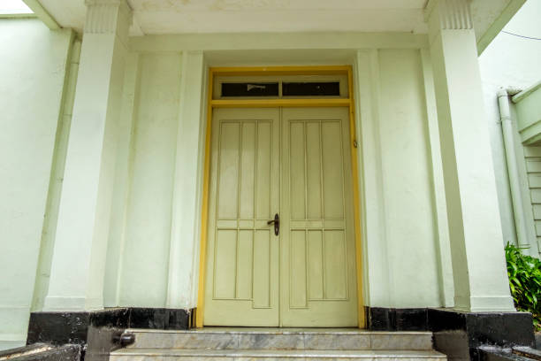 Closed wooden door on stone wall