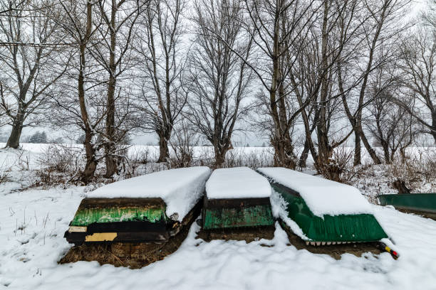 istock A boats covered with snow on the coast 1124641511