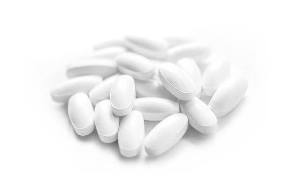 istock heap of white medicine tablets 1124642065