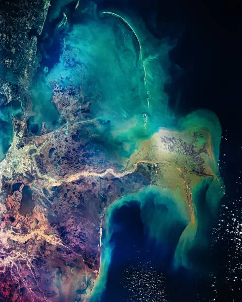 Photo of Distribution pattern of muddy fresh water from the Mississippi River as it flows into the Gulf of Mexico. New Orleans. Colorful collage. The elements of this image furnished by NASA.