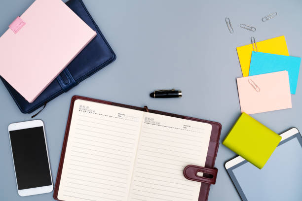 istock diary notebook with smartphone, office stationery multicolor stick paper 1124642506