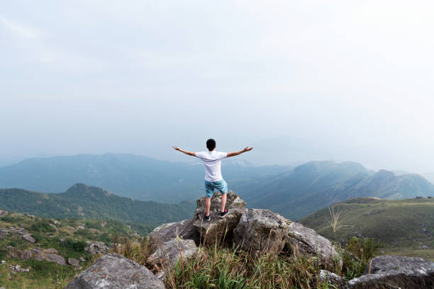 istock Man on the top of mountain 1124645381