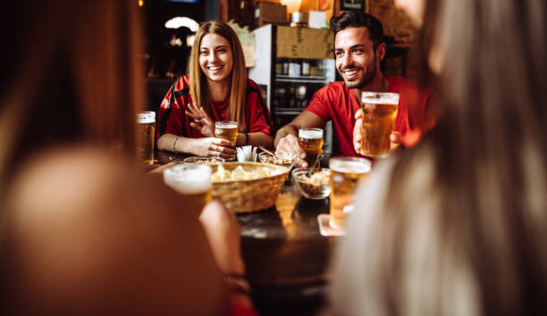 istock people talking and drinking in a pub with the beers 1124646439