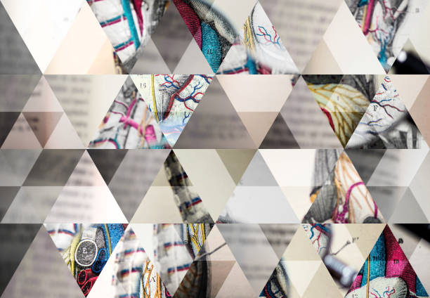 Abstract triangle mosaic background: Magnifying glass on antique anatomy book
