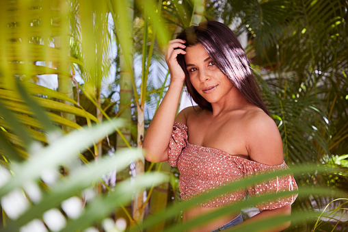 Beautiful woman amongst plants, portrait