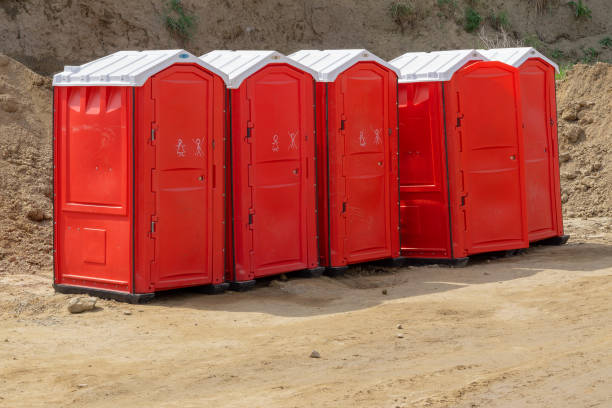 istock red portable toilets for outdoor event 1124648042