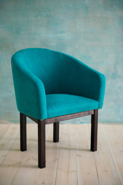 istock Blue chair against the blue wall. Interior 1124648050