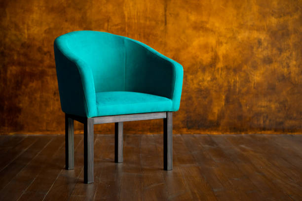 istock Blue chair against a brown wall. Interior 1124648069