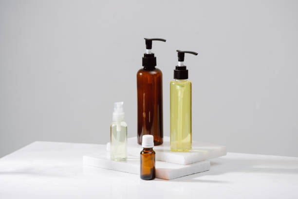 istock Spa cosmetics in brown glass bottles on gray concrete table. Copy space for text. Beauty blogger, salon therapy, branding mockup, minimalism concept 1124649050