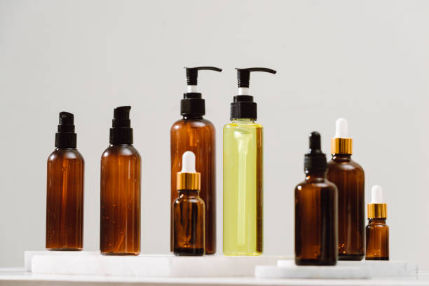 istock Spa cosmetics in brown glass bottles on gray concrete table. Copy space for text. Beauty blogger, salon therapy, branding mockup, minimalism concept 1124649271