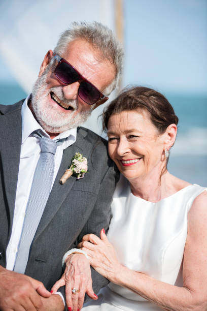 istock Senior couple getting married at the beach 1124649403