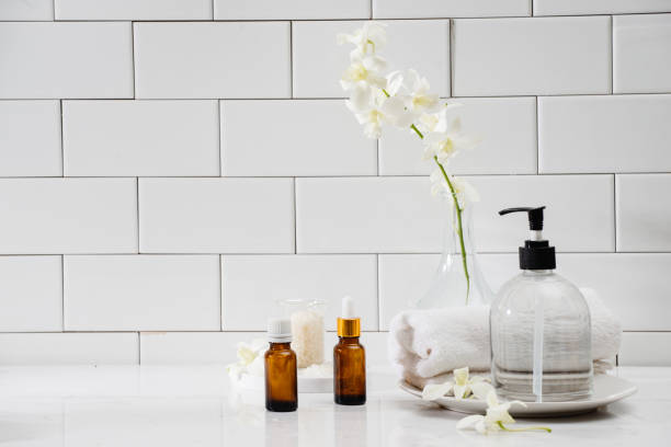 istock Bottles with massage essentials oils, towels. Spa composition. 1124650665